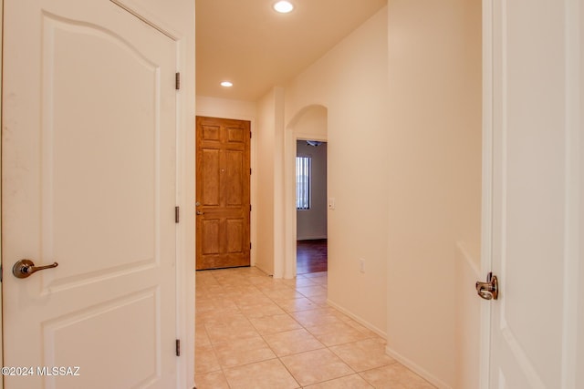 corridor featuring light tile patterned flooring