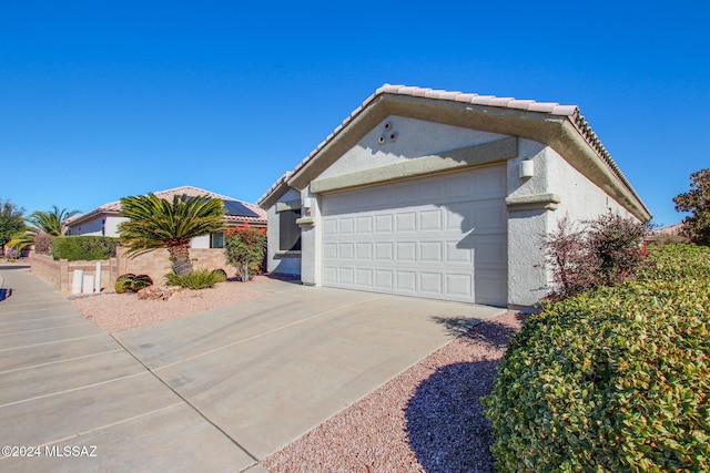 view of side of property featuring a garage