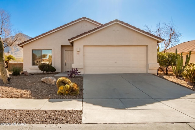 single story home featuring stucco siding, a garage, concrete driveway, and a tiled roof