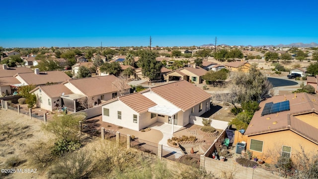 birds eye view of property with a residential view