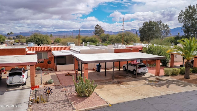 view of front of home featuring a carport and a mountain view