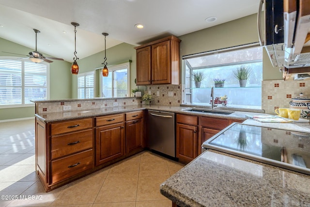 kitchen featuring stainless steel dishwasher, kitchen peninsula, light tile patterned floors, and sink