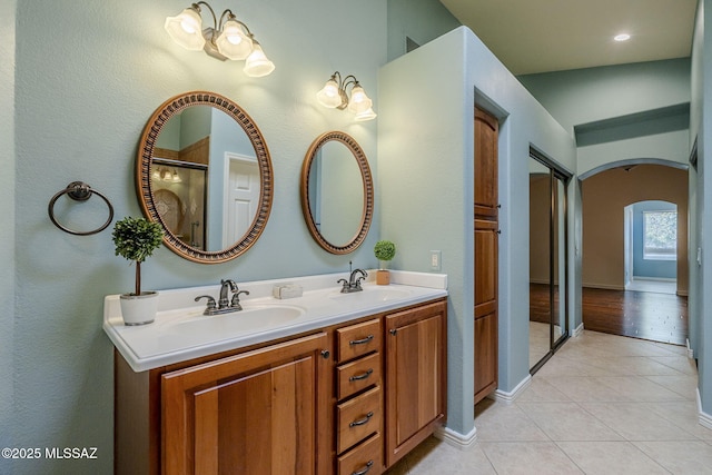 bathroom with tile patterned floors and vanity