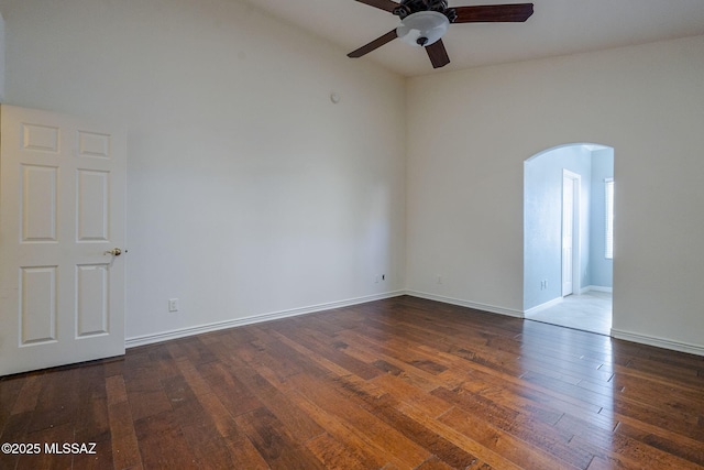 unfurnished room featuring dark hardwood / wood-style flooring and ceiling fan