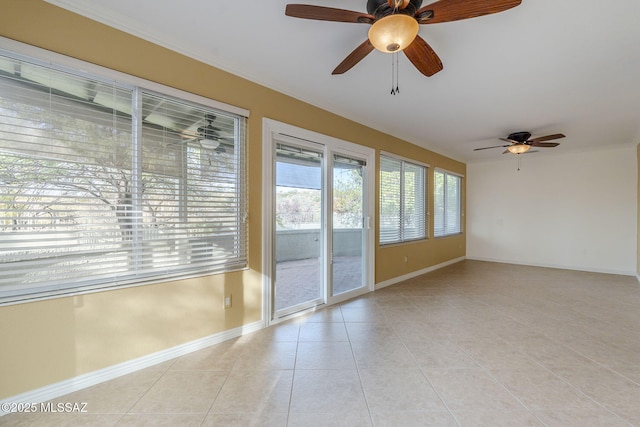 empty room featuring ceiling fan and light tile patterned floors