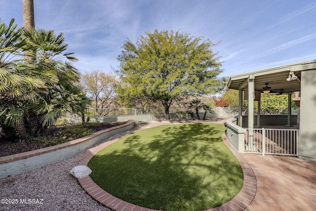 view of yard featuring ceiling fan