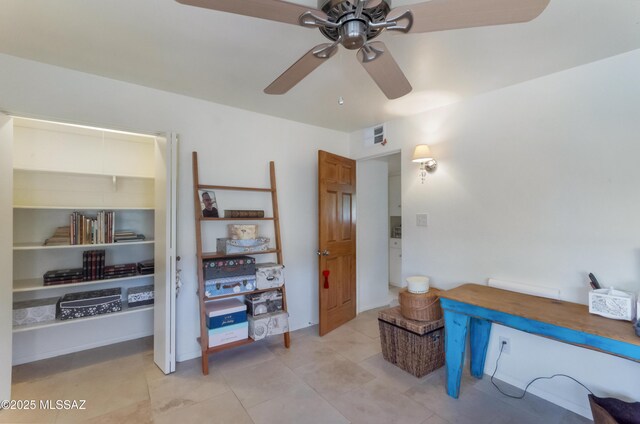 kitchen with wood counters, sink, decorative light fixtures, a skylight, and white cabinets