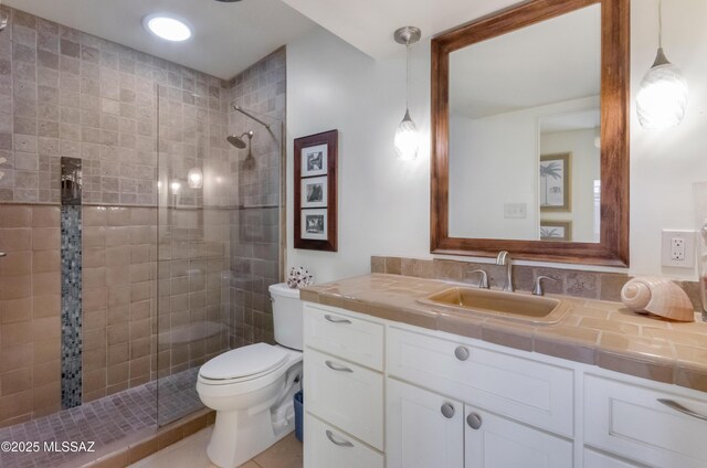 tiled bedroom featuring ceiling fan and brick wall