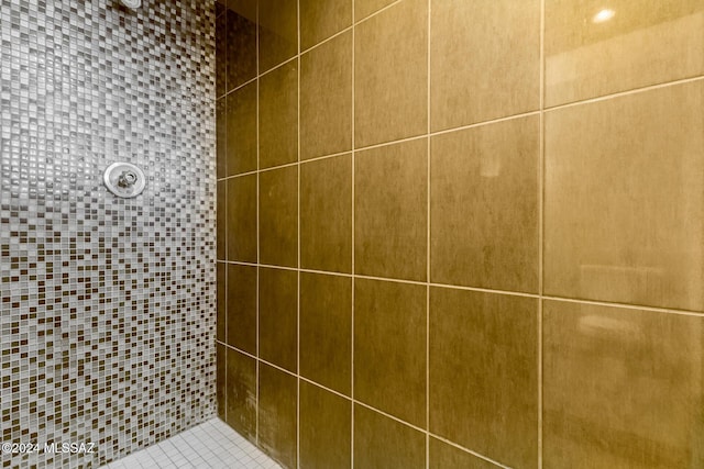 bathroom with tiled shower