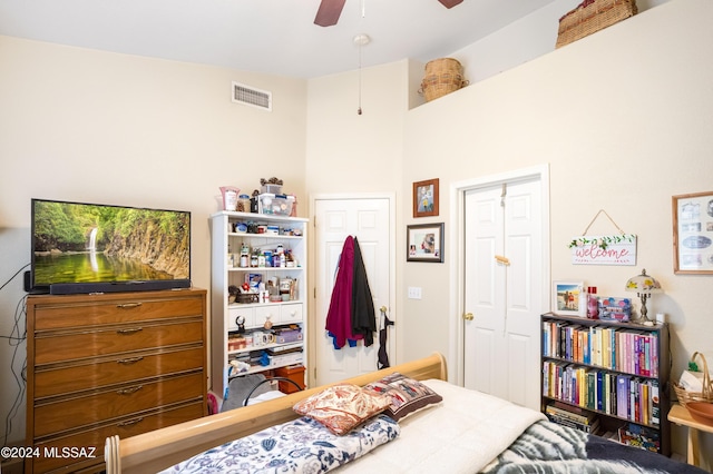 bedroom featuring ceiling fan and a closet