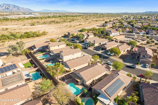 birds eye view of property with a mountain view