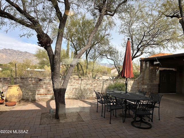 view of patio / terrace featuring a mountain view