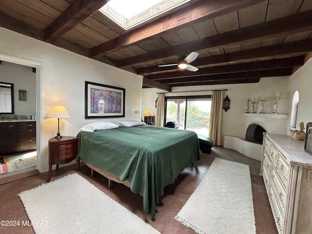 bedroom with access to exterior, ensuite bathroom, a skylight, wood ceiling, and beam ceiling