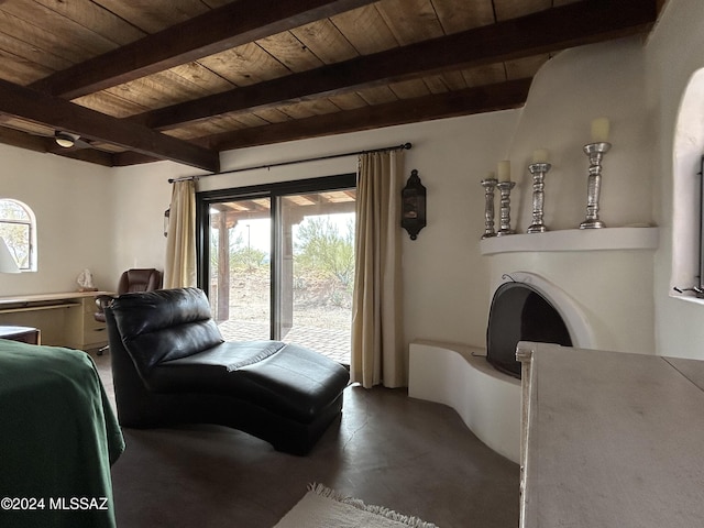 living room with beam ceiling, wooden ceiling, and a healthy amount of sunlight