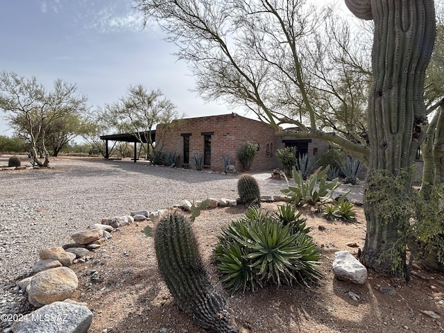 exterior space with a carport