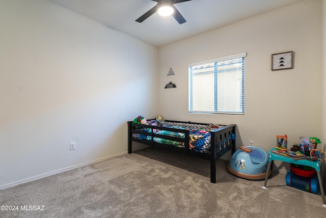 carpeted bedroom featuring ceiling fan