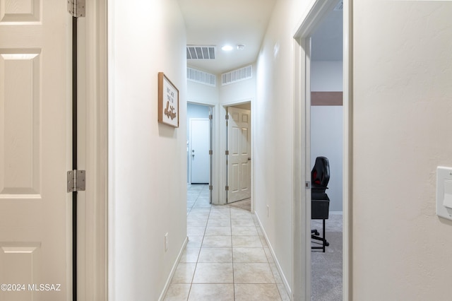 hallway with light tile patterned floors