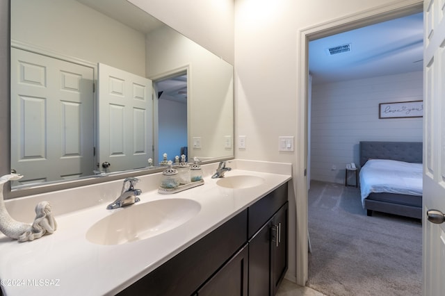 bathroom with vanity and wooden walls