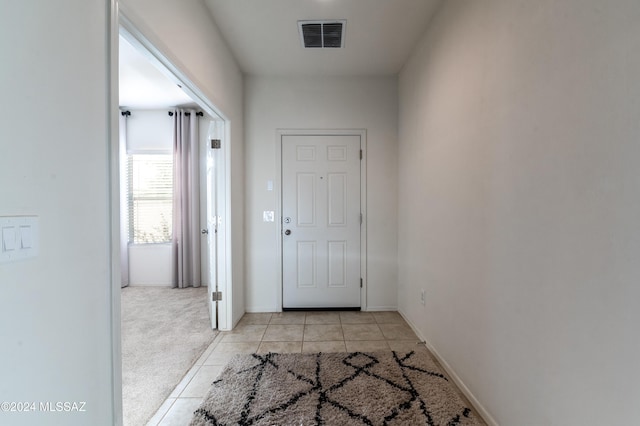 doorway to outside featuring light tile patterned floors