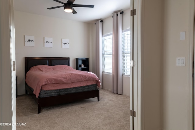 bedroom featuring ceiling fan and light colored carpet