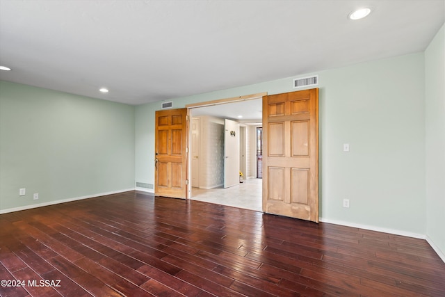 unfurnished room with hardwood / wood-style floors