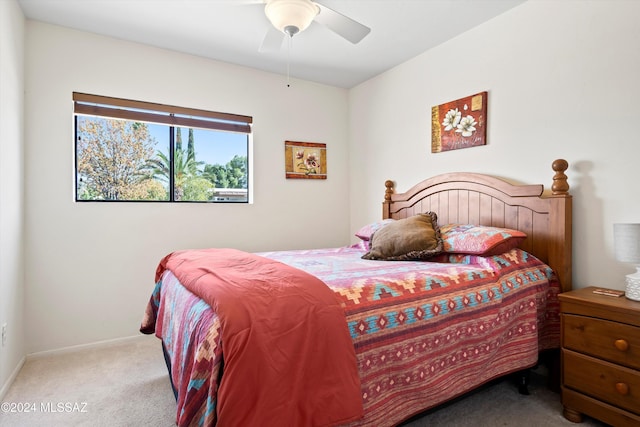 bedroom featuring ceiling fan and light colored carpet