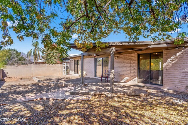 rear view of property featuring a patio area