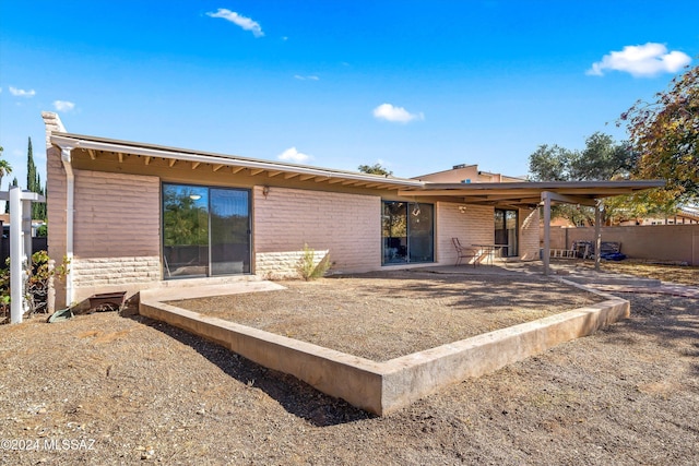 rear view of property with a patio area