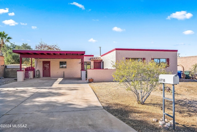 view of front of home featuring a carport