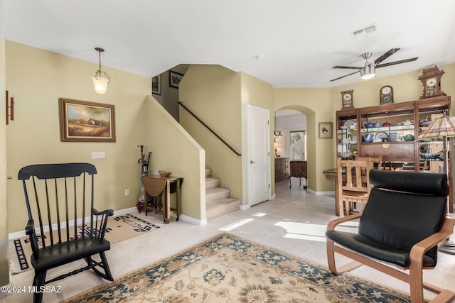 sitting room with ceiling fan and light tile patterned floors