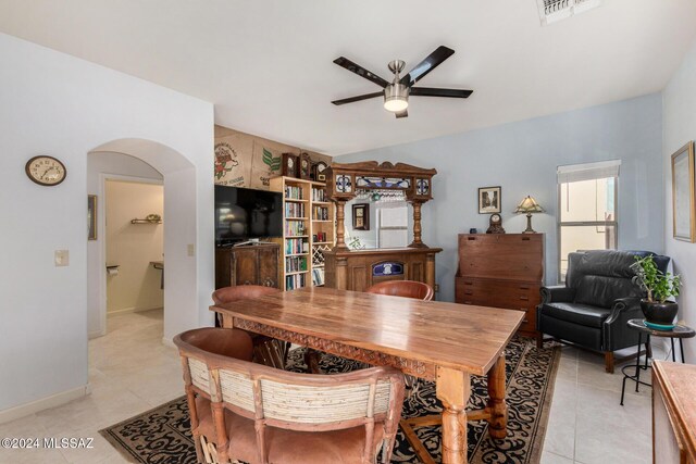 kitchen featuring appliances with stainless steel finishes, decorative light fixtures, white cabinets, backsplash, and light stone countertops