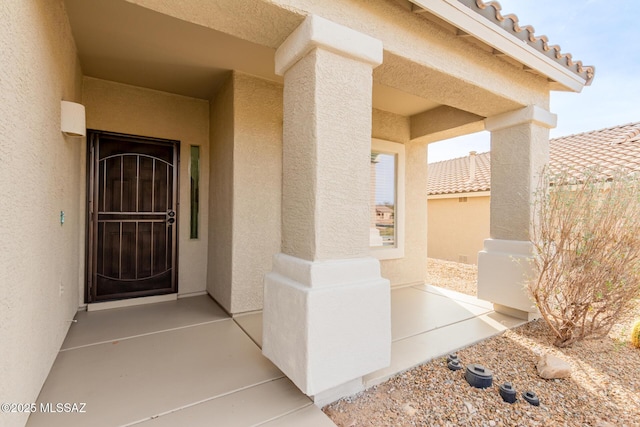 entrance to property with a patio area