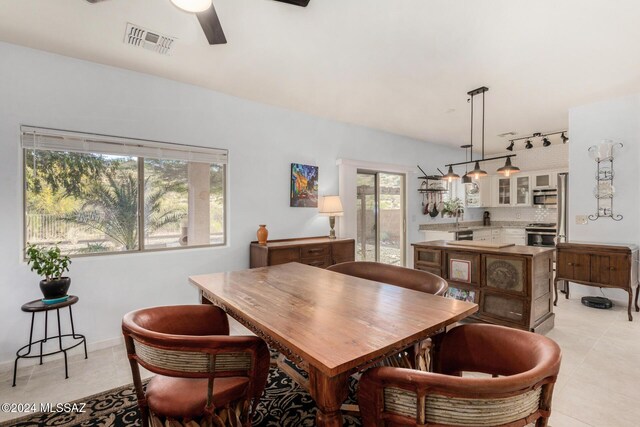 tiled office featuring ceiling fan