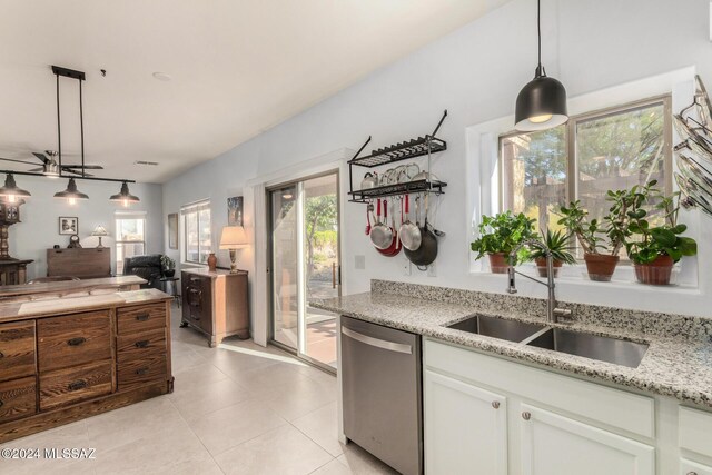 tiled dining area with ceiling fan