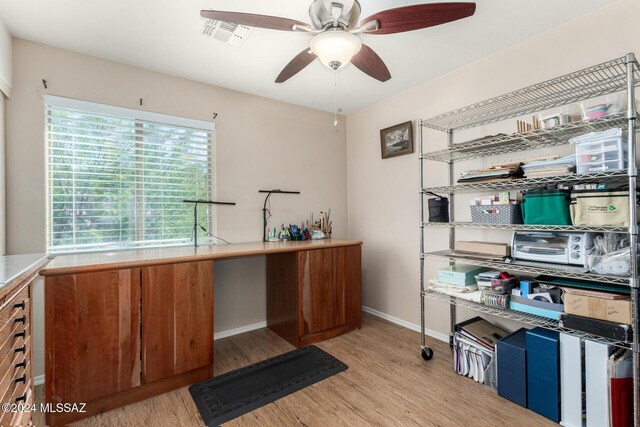 bedroom with light carpet and ceiling fan