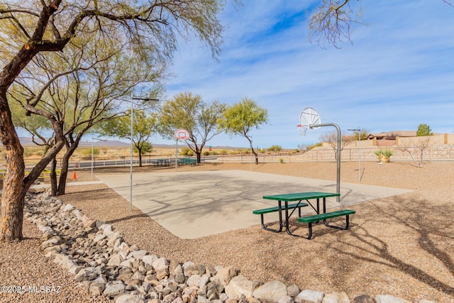 rear view of property featuring a pergola, central AC, and a patio area