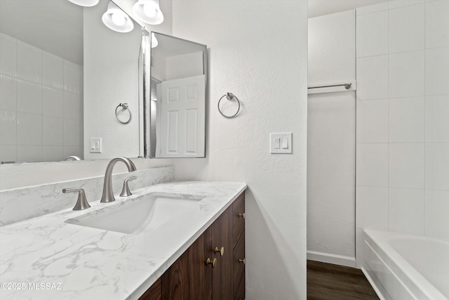 bathroom with wood-type flooring and vanity