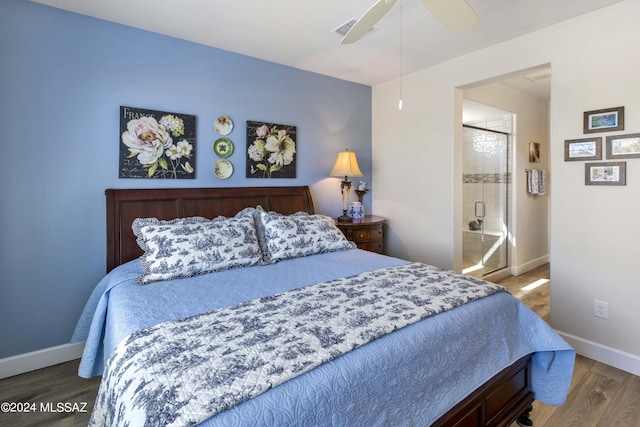 bedroom featuring ceiling fan, connected bathroom, and hardwood / wood-style flooring