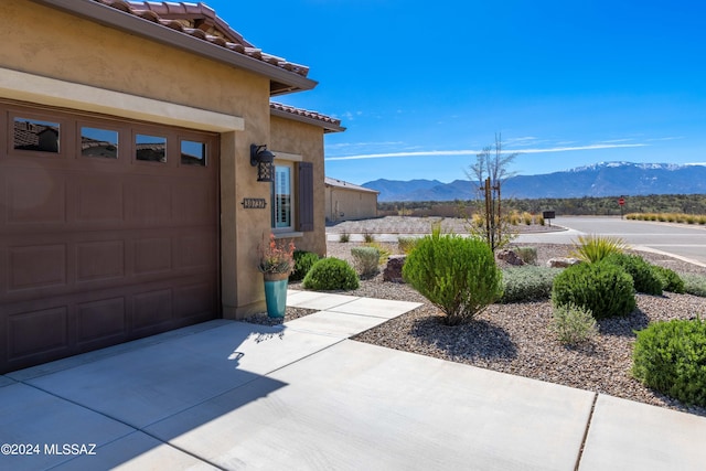 garage featuring a mountain view