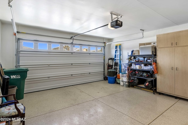 garage featuring a garage door opener