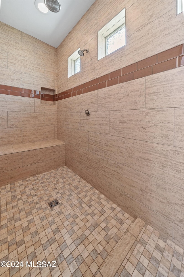 bathroom with tiled shower