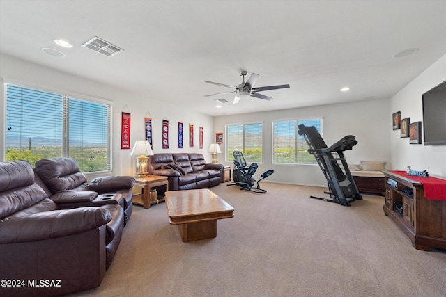 living room featuring light colored carpet, visible vents, plenty of natural light, and recessed lighting