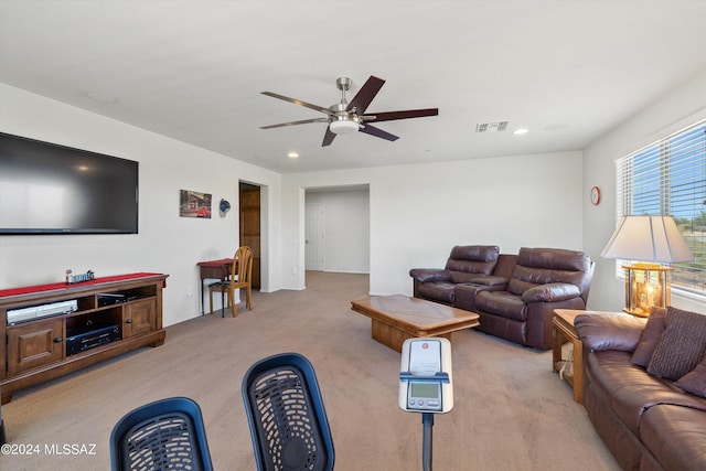 living area with light carpet, recessed lighting, visible vents, and a ceiling fan