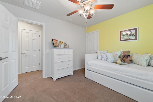 bedroom featuring carpet floors, visible vents, ceiling fan, and baseboards