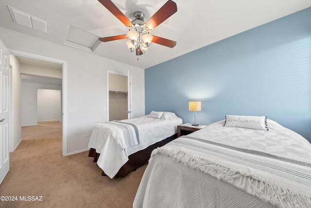 bedroom featuring attic access, baseboards, visible vents, light colored carpet, and a closet