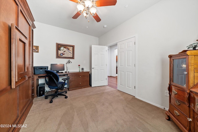 home office featuring baseboards, a ceiling fan, and light colored carpet