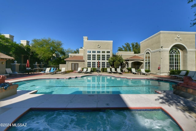 view of pool featuring a patio