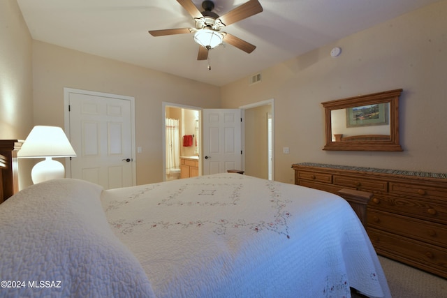 bedroom featuring ceiling fan and ensuite bath