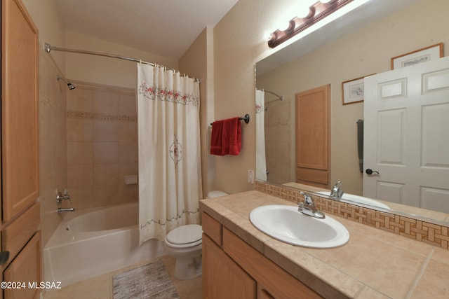 full bathroom featuring shower / tub combo, vanity, tile patterned floors, and toilet