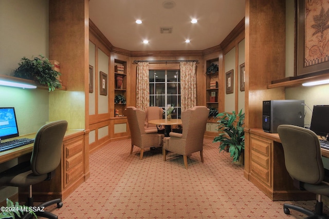 home office with crown molding and built in desk